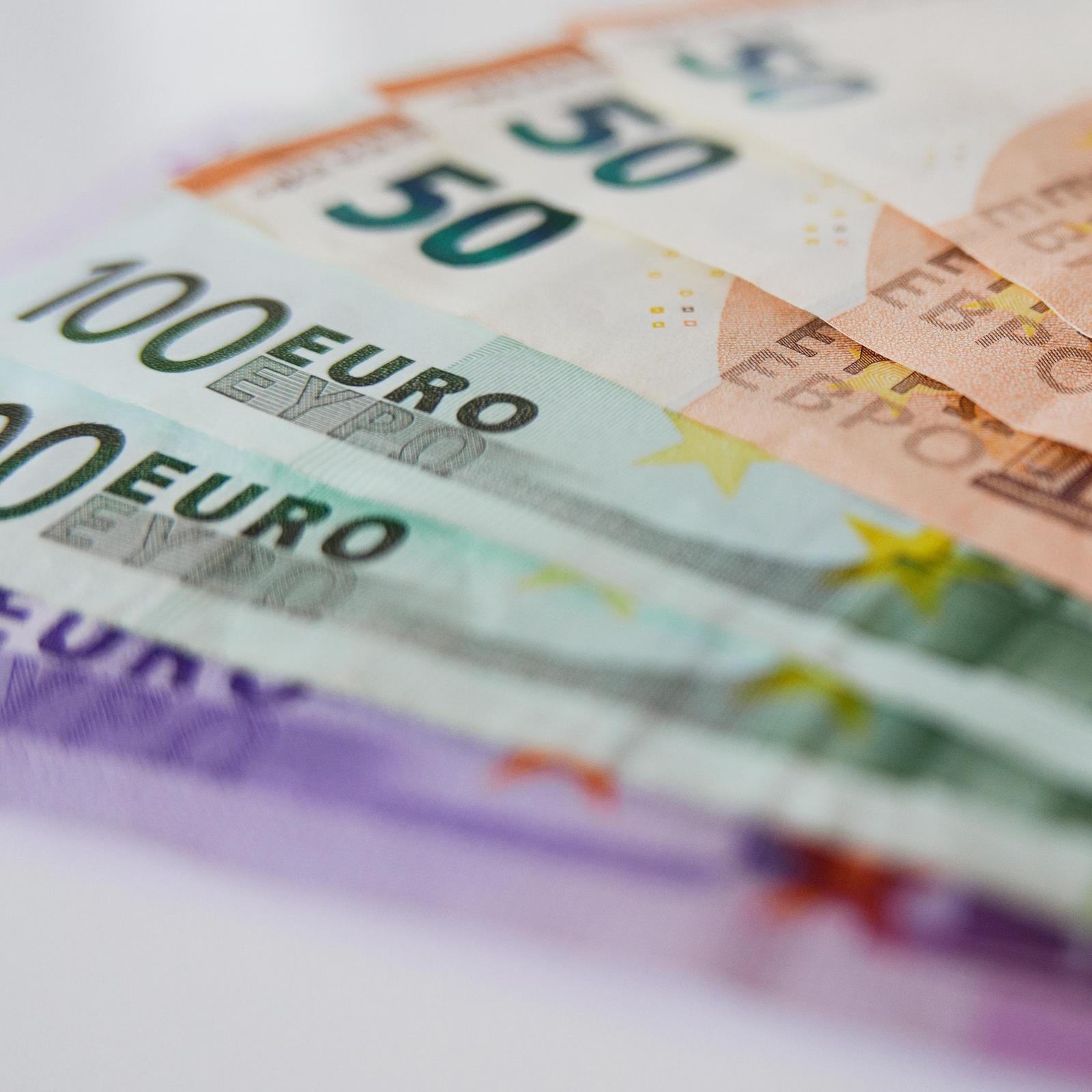 euro banknotes on a table